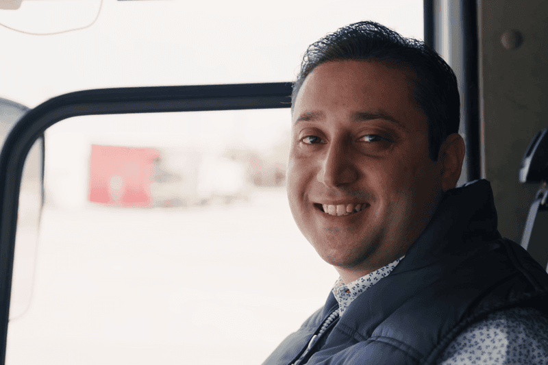 Picture of Zaher Mukhalalati in a truck cabin