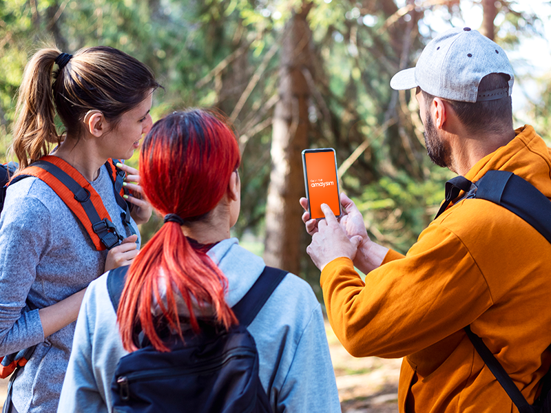 Group of people checking out an app on an amaysim device